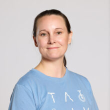 A person in a blue T-shirt looking at the camera.